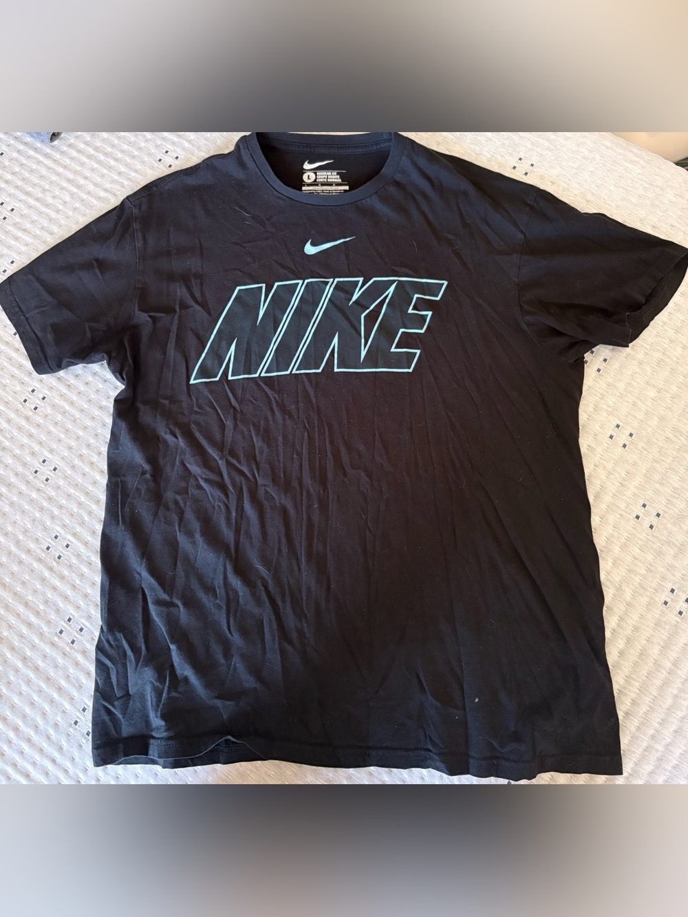 Nike Black T‑Shirt with Light Blue Swoosh
